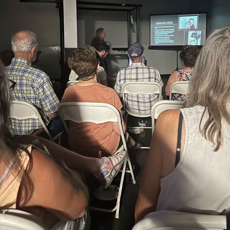 Female Veterinarian Giving A Lecture To Audience