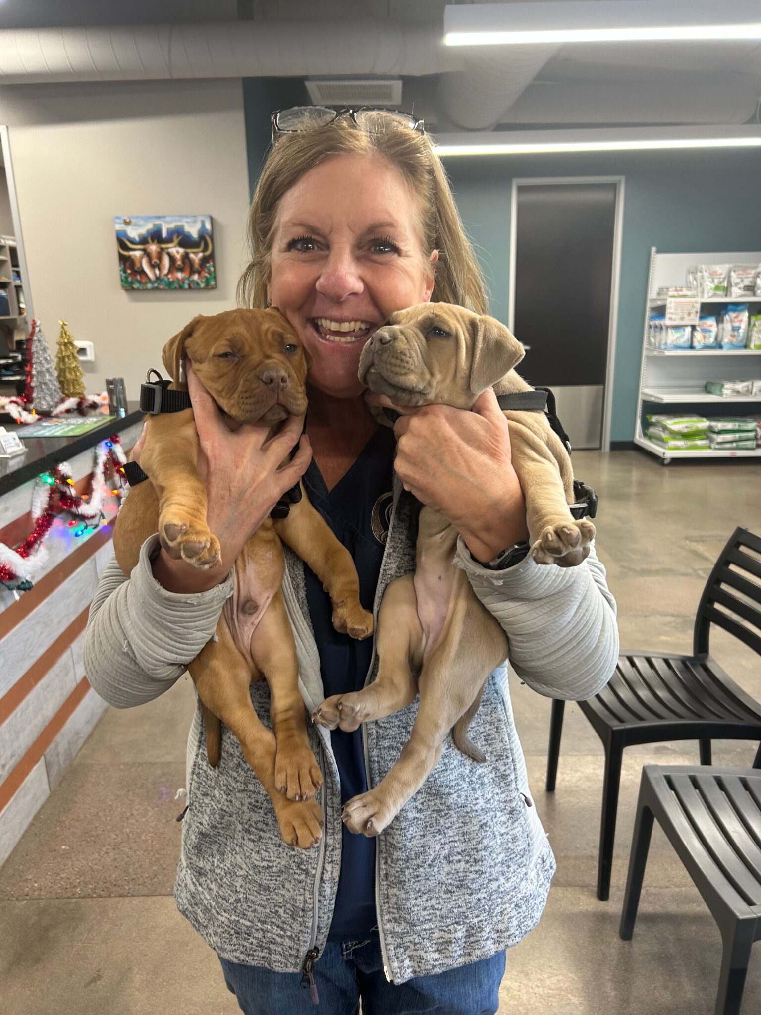 Dr. Ruisi with two puppies
