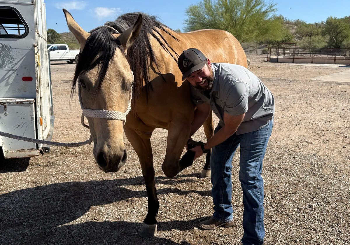 Dr. Scott Checking Horses Hoof Dr. Scott Checking Horses Hoof